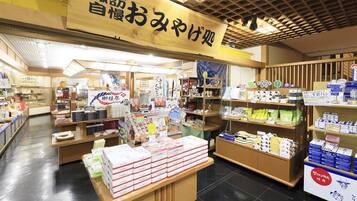 A traditional Japanese store with wooden interiors and various packaged goods on display.