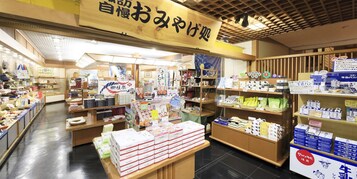 A traditional Japanese store with wooden interiors and various packaged goods on display.