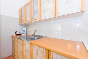 Apartment, 1 Bedroom | Private kitchen | Full-size fridge, oven, stovetop, coffee/tea maker - Apartments Guido close from the beach (Medulin)
