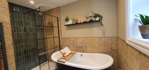 Bathtub, hair dryer, towels, soap