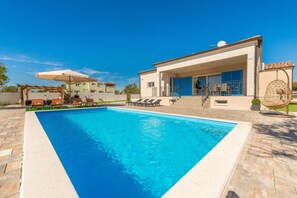 Seasonal outdoor pool, pool umbrellas, pool loungers