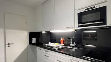 Mini-fridge, microwave, stovetop, coffee/tea maker