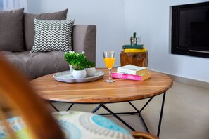 Smart TV, fireplace, books, printers