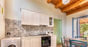 Villa, 2 Bedrooms | Private kitchen | Full-size fridge, oven, stovetop, cookware/dishes/utensils