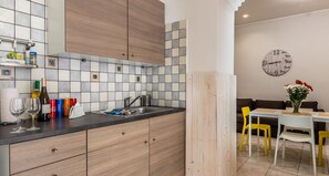 Appartement, 2 chambres | Coin cuisine privé | Grand réfrigérateur, four, plaque de cuisson, machine à expresso