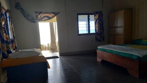 A room with two beds, a wardrobe, and a window with curtains. - Unspoiled South Gambian Paradise '' Luxury Beach House '' (Kartung)