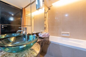 Family Studio Suite (22-106) | Bathroom | Shower, hair dryer, slippers, bidet