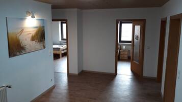 Apartment, 4 Bedrooms, Balcony (Dachgeschoss) | Living area | Flat-screen TV