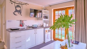 Standard Apartment, 3 Bedrooms | Private kitchen | Coffee/tea maker, full-size fridge, microwave, stovetop - Sun & Sea Apartment (Cape Town)