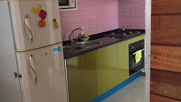 Family Apartment, 2 Bedrooms | Private kitchen | Full-size fridge, microwave, oven, stovetop