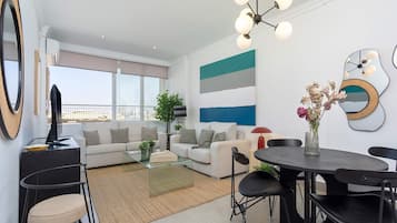 Apartment (1 Bedroom) | Living area | 32-inch TV with cable channels