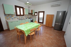 Apartment, 2 Bedrooms | Private kitchen | Full-size fridge, oven, stovetop, cookware/dishes/utensils