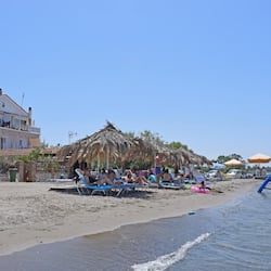 On the beach, sun-loungers, beach umbrellas