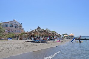On the beach, sun loungers, beach umbrellas - Petrakis Beach (Corfu)