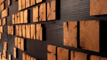 A wall with wooden panels arranged in a grid pattern.