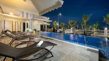 Outdoor pool, open 7:00 AM to 9:00 PM, pool umbrellas, sun loungers
