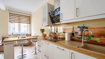 Suite estudio Confort | Cocina privada | Refrigerador, microondas, parrilla de estufa y lavavajillas