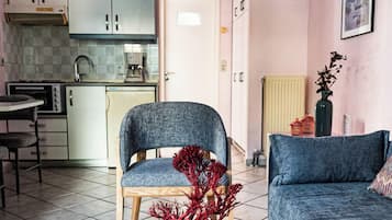 Apartment, Ground Floor | Living area | 32-inch flat-screen TV with digital channels, TV