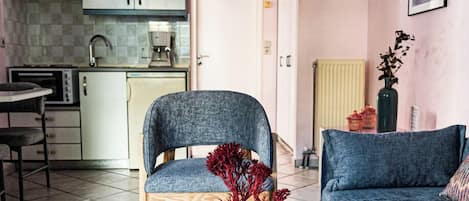 Apartment, Ground Floor | Living area | 32-inch flat-screen TV with digital channels, TV