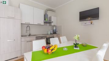 Family Apartment, 2 Bedrooms | Private kitchen | Fridge, microwave, stovetop, coffee/tea maker