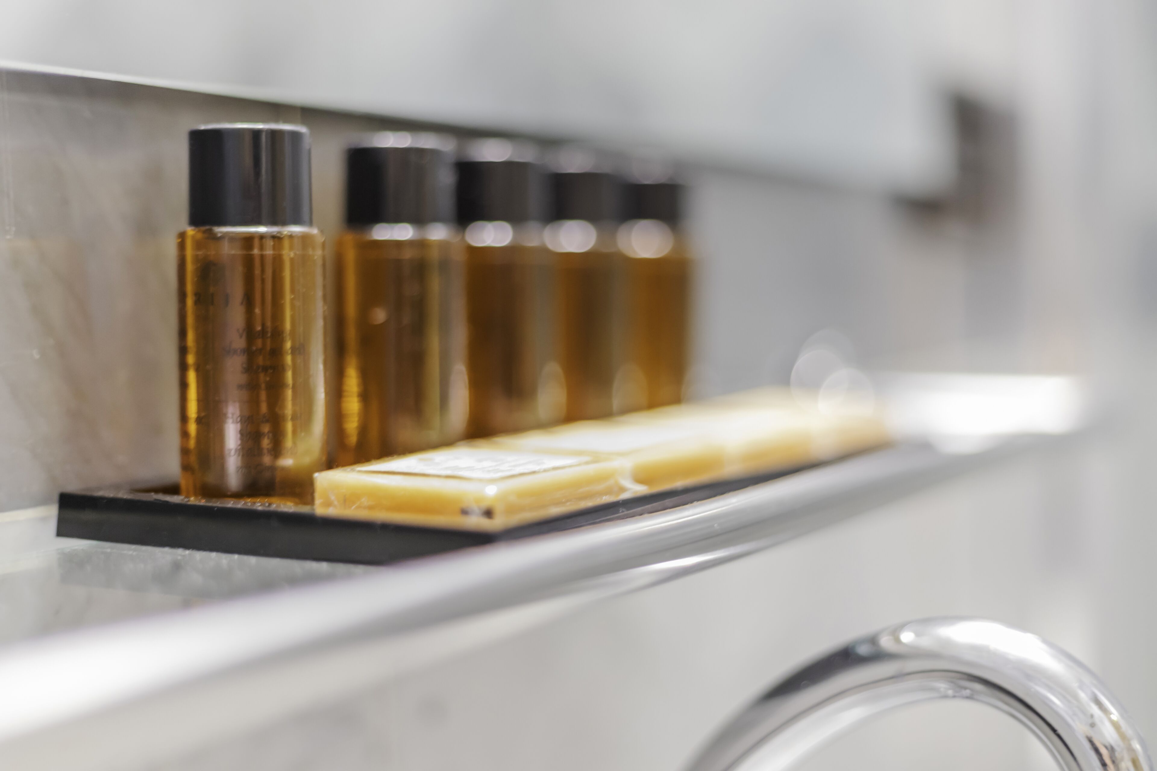 A bathroom shelf with toiletries.