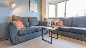 Apartamento luxo | Área de estar | TV de tela plana