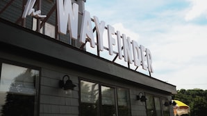 A building with a sign that reads "The Wayfinder."