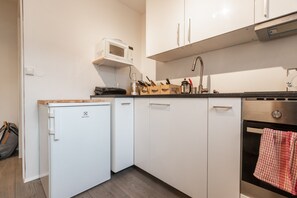 City Apartment, 1 Bedroom | Private kitchen | Fridge, oven, stovetop, coffee/tea maker - Apartment S14 (Reykjavik)