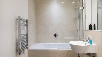 Combined shower/bathtub, hair dryer, towels, soap