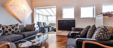 Family Apartment, 3 Bedrooms | Living area | Flat-screen TV