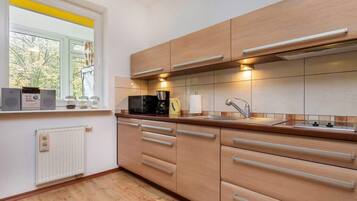 Fridge, microwave, stovetop, coffee/tea maker
