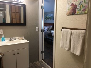 Shower, hair dryer, towels, soap