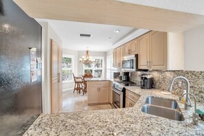 Coffee/tea maker, fridge, microwave, oven - Lake View Villa with a 1 Car Garage, 2 Bedrooms in Lakeside of Naples, Fl (Naples)