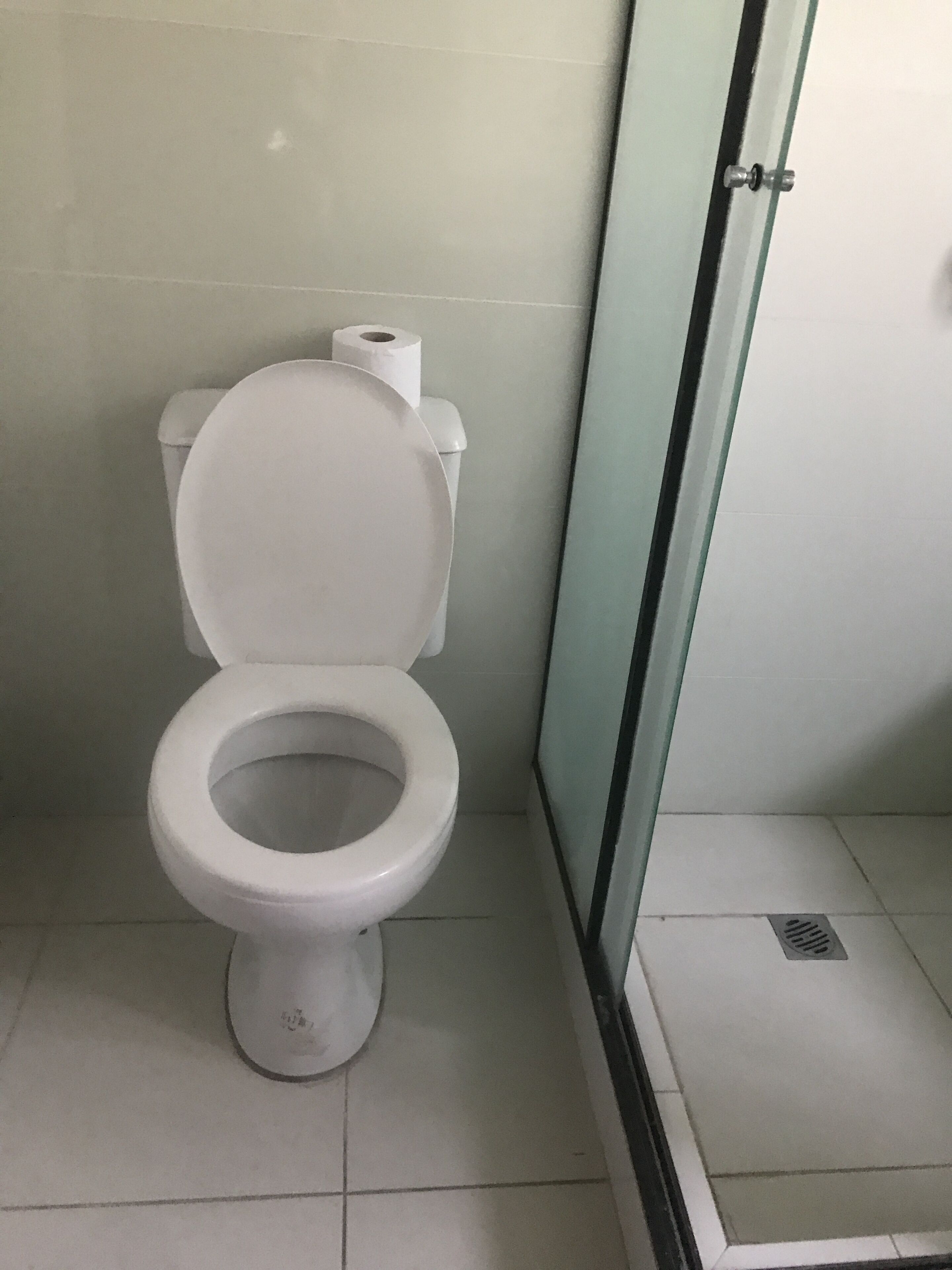 basic double room, 1 queen bed | bathroom | shower, towels, soap, shampoo