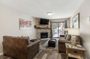 Smart TV, fireplace, books