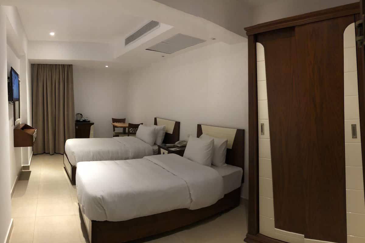 Superior Quadruple Room, Multiple Beds | Minibar, in-room safe, desk, laptop workspace