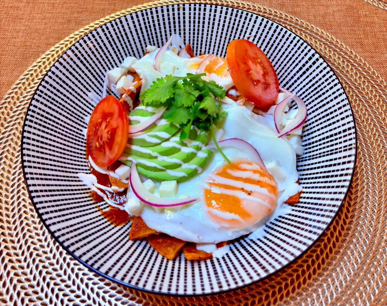 A plate of food with a patterned bowl.
