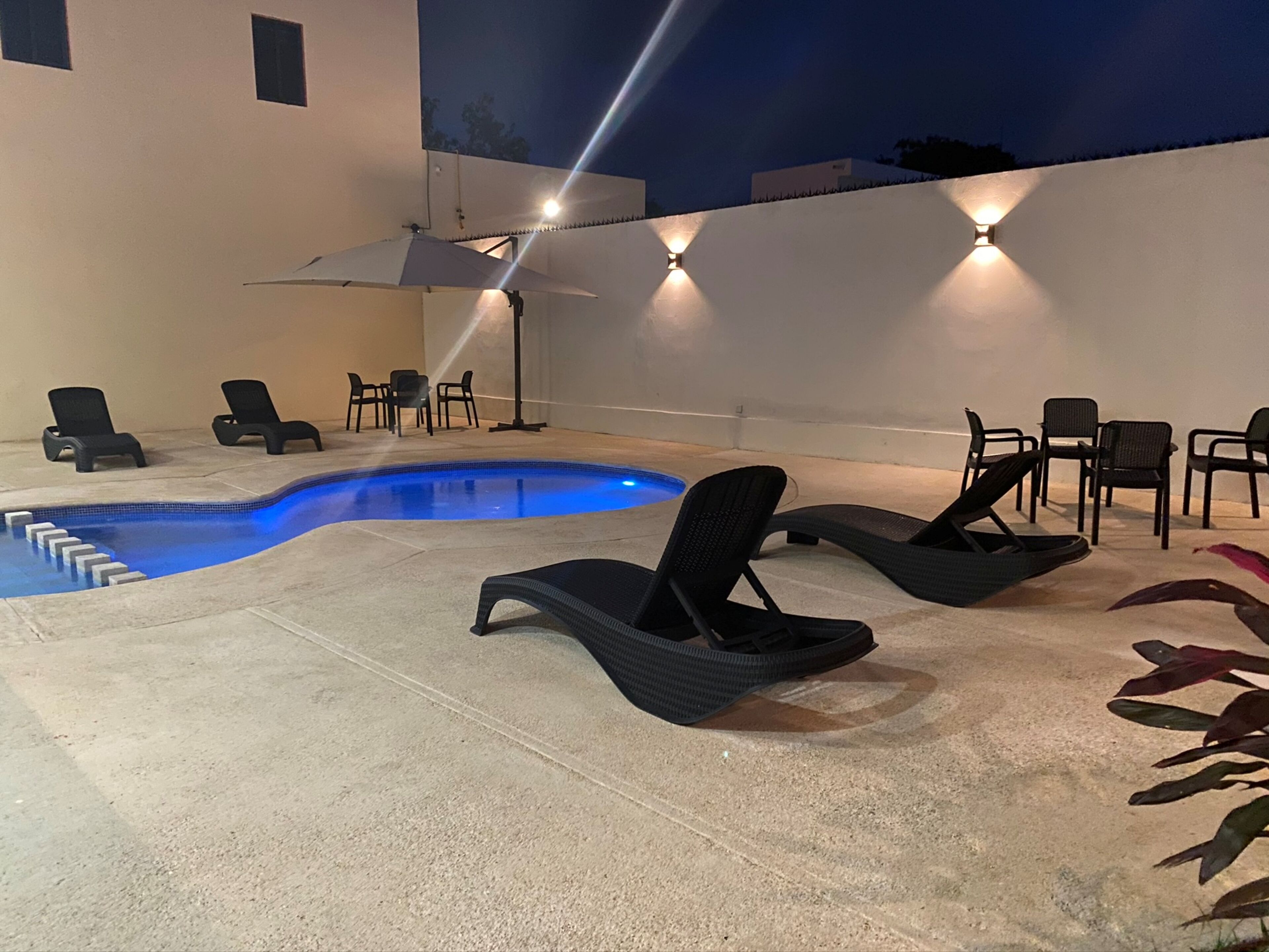 outdoor pool, open 8:00 am to 10:00 pm, pool umbrellas, pool loungers