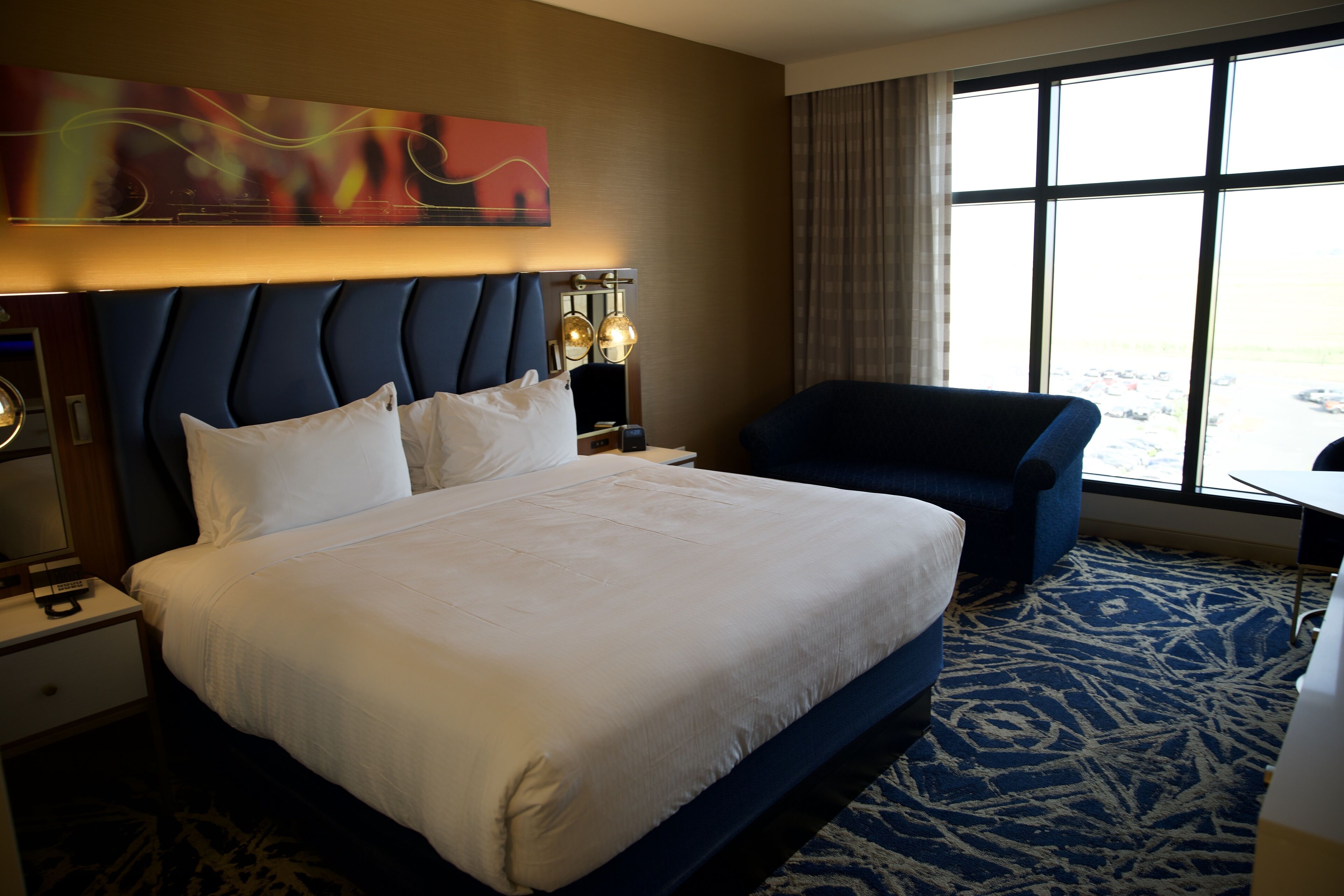 deluxe room, 1 king bed | in-room safe, blackout curtains, iron/ironing board, cots/infant beds