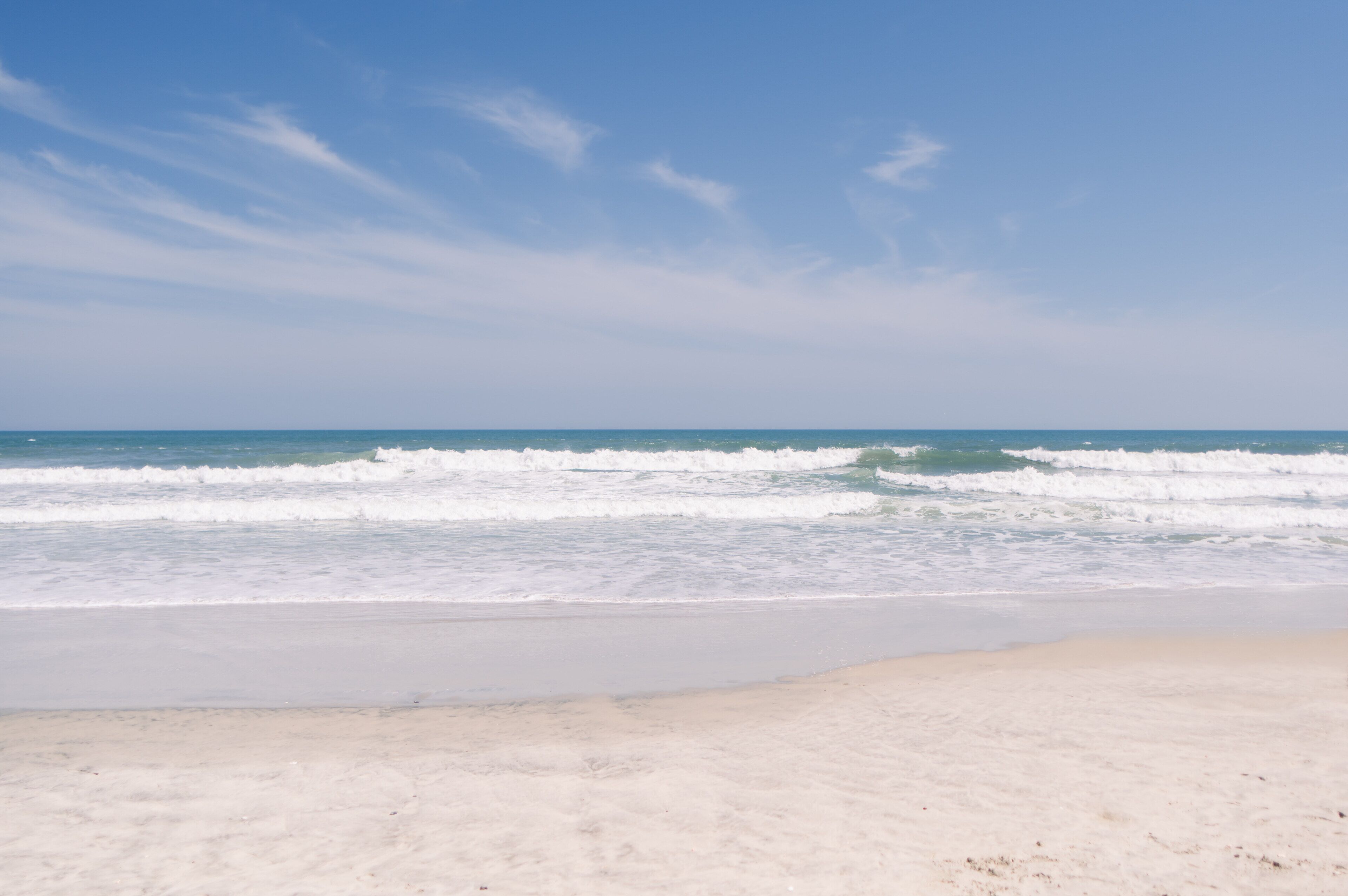 On the beach, sun-loungers