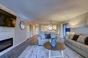 Cozy living space with a fireplace, sofa, and coffee table, offering a comfortable seating area.