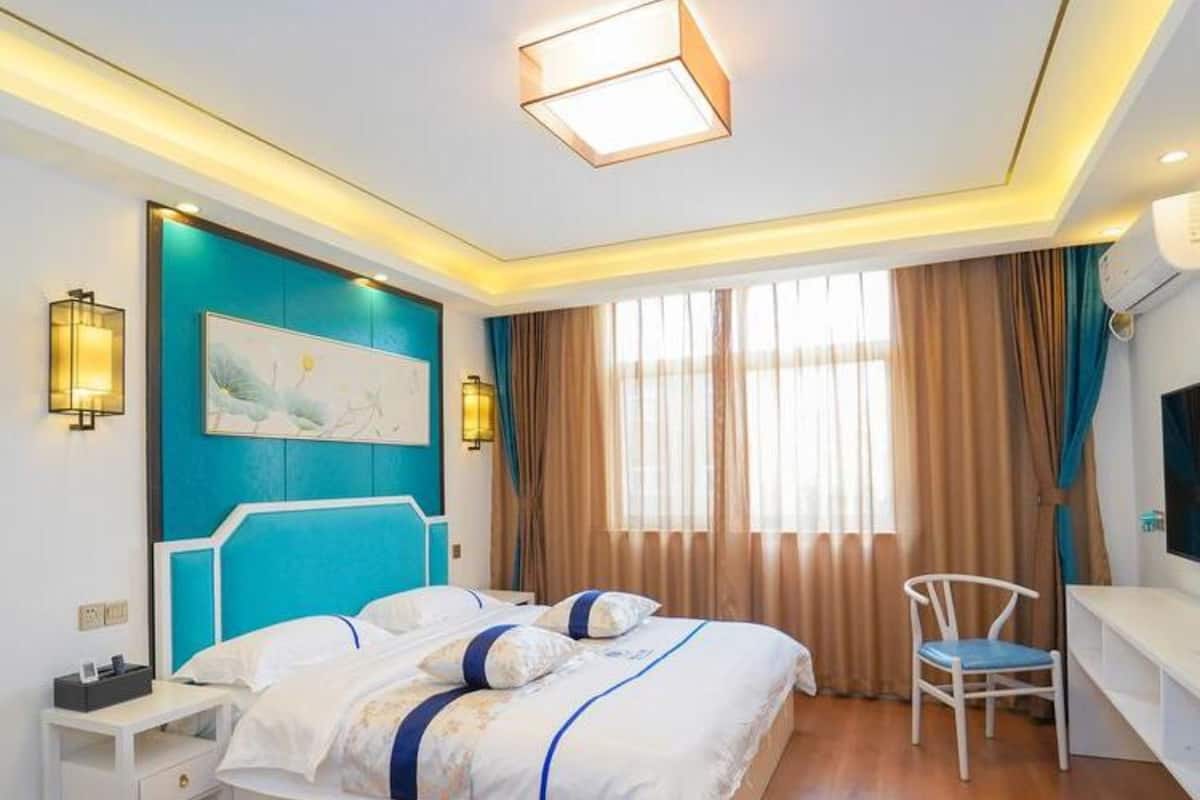 Habitación familiar (Mainland Chinese Citizen Only) | Escritorio, cortinas opacas, wifi gratis