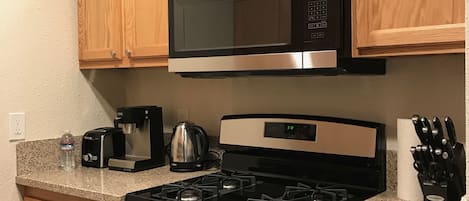 Microwave, dishwasher, coffee/tea maker, cookware/dishes/utensils