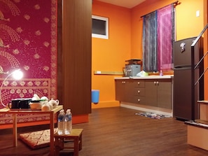 Fridge, microwave, cleaning supplies, paper towels