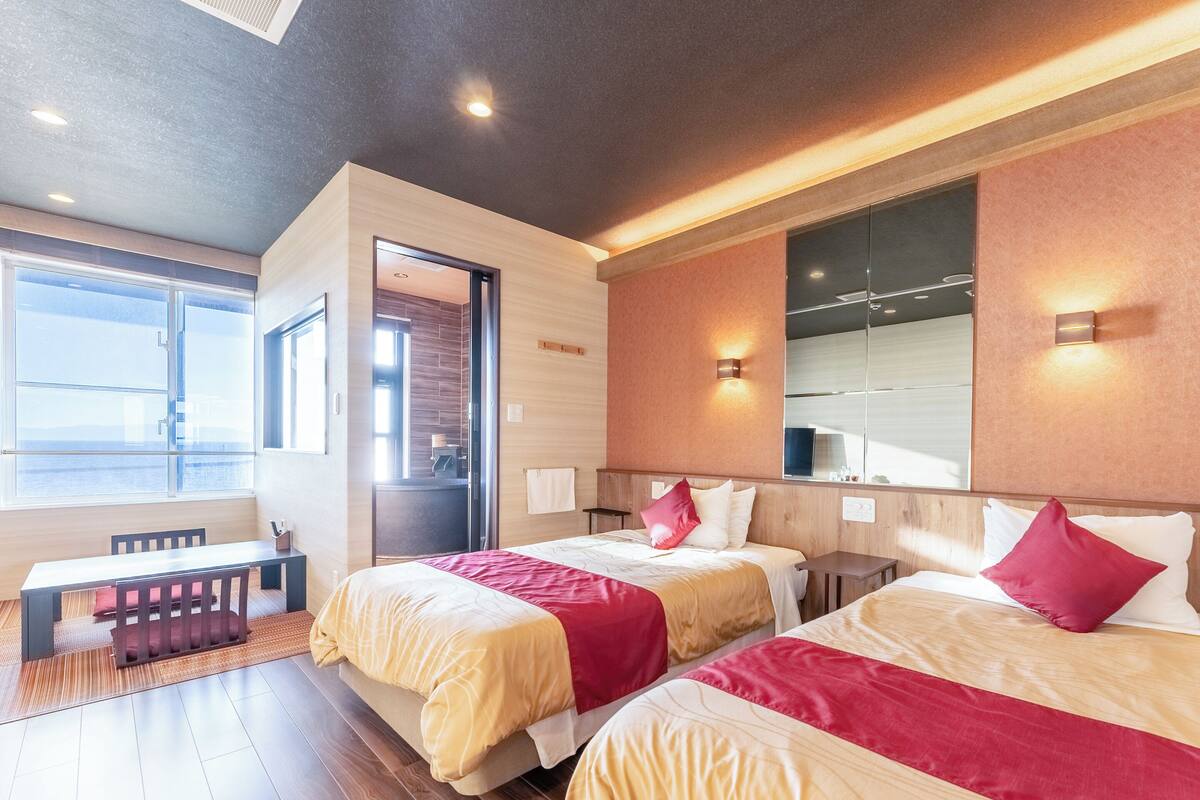 スタンダード ツインルーム 喫煙可 オーシャンビュー | セーフティボックス (室内)、デスク、WiFi (無料)、ベッドシーツ