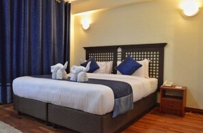 Executive Room | Minibar, in-room safe, desk, blackout drapes - Cranes Suites Hotel (Kitale)