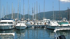 A marina with multiple boats docked. - Apartment in Corsica near Palombaggia Beach (Porto-Vecchio)