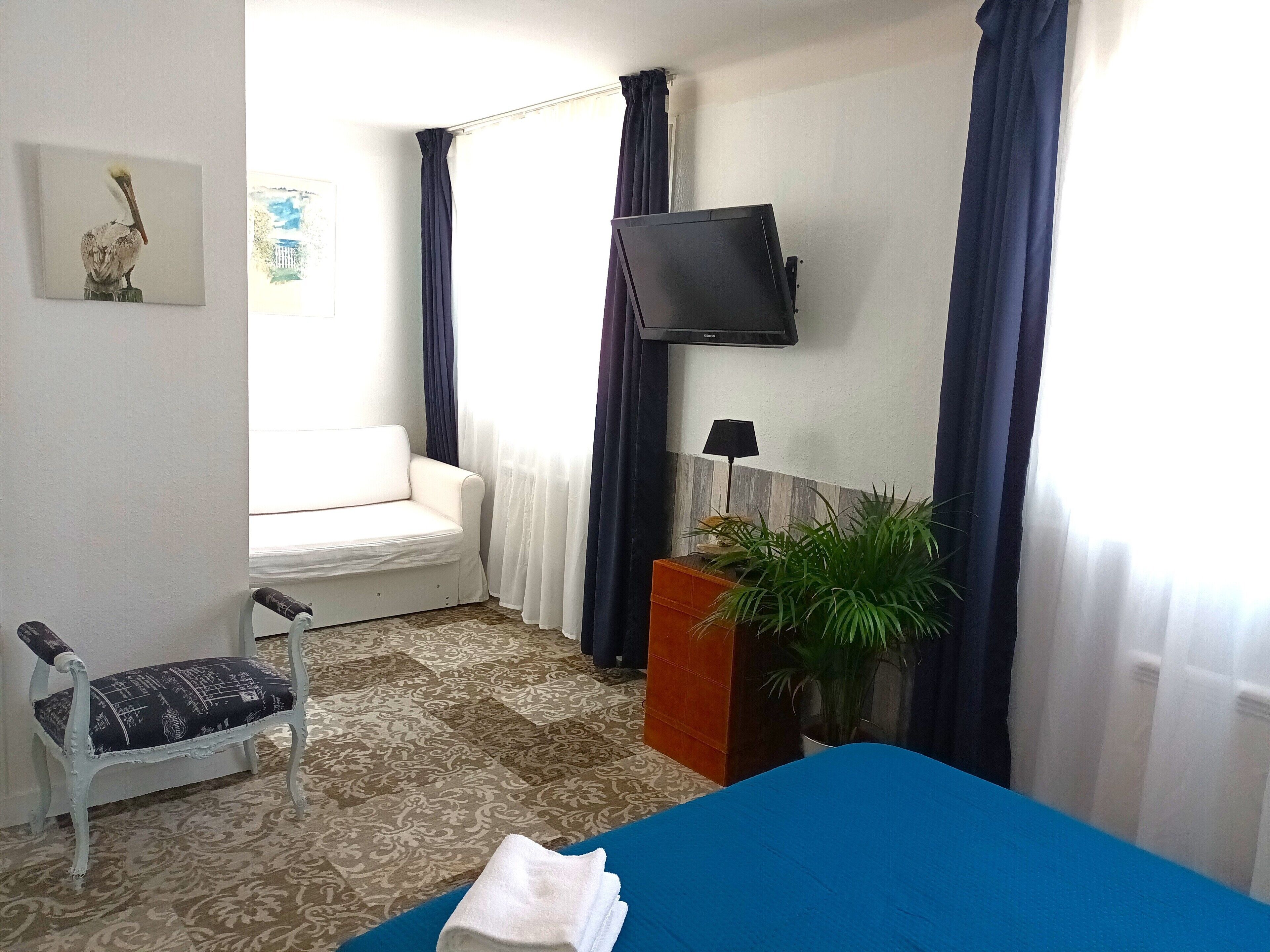 family room | 1 bedroom, in-room safe, individually decorated, individually furnished