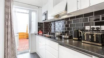 Mini-fridge, microwave, stovetop, coffee/tea maker