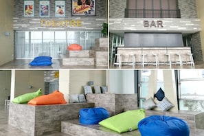 Relax in a casual theatre area with a bean bag chair or socialize at the bar with stools.